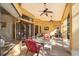 Covered patio with ceiling fans provides comfortable outdoor dining and lounging, offering golf course views at 2313 Roat Dr, Orlando, FL 32835