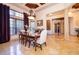 The dining room has travertine floors, a dark wood table, and a view into the foyer at 2313 Roat Dr, Orlando, FL 32835
