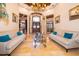 The foyer features soaring ceilings, travertine floors, and a decorative chandelier at 2313 Roat Dr, Orlando, FL 32835