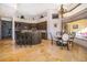 A kitchen with a granite breakfast bar, stone floors, and breakfast nook overlooking the lanai at 2313 Roat Dr, Orlando, FL 32835