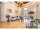 Sunlit living room with travertine floors, a view of the pool, and elegant furnishings at 2313 Roat Dr, Orlando, FL 32835