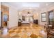 A bright main bedroom features tile floors, a decorative tray ceiling, and plenty of natural light through multiple windows at 2313 Roat Dr, Orlando, FL 32835