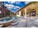 Beautiful pool and spa area offers a serene outdoor retreat with lush landscaping and a screened enclosure at 2313 Roat Dr, Orlando, FL 32835