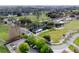 Panoramic aerial showcasing the community golf course, lush greenery, and beautifully-maintained landscape at 290 Thomas Dr, Casselberry, FL 32707
