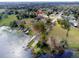 Aerial view of lakefront community featuring boat docks, a kayak launch, and convenient lake access at 290 Thomas Dr, Casselberry, FL 32707