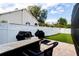 Backyard with a grill and manicured lawn at 290 Thomas Dr, Casselberry, FL 32707