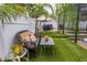 Backyard oasis featuring a bench and decorative plants at 290 Thomas Dr, Casselberry, FL 32707