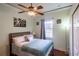 Bedroom featuring a ceiling fan, light walls and hardwood floors at 290 Thomas Dr, Casselberry, FL 32707