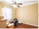 Spare bedroom with hardwood floors and a ceiling fan at 290 Thomas Dr, Casselberry, FL 32707