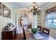 Elegant dining room with a chandelier and ample natural light at 290 Thomas Dr, Casselberry, FL 32707