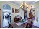 Formal dining room with arched doorways and seamless entry to kitchen and living space at 290 Thomas Dr, Casselberry, FL 32707
