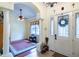 Welcoming foyer with ceramic tile flooring, columns and natural light at 290 Thomas Dr, Casselberry, FL 32707