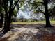 Scenic view of the golf course featuring lush fairways and mature trees, perfect for recreation at 290 Thomas Dr, Casselberry, FL 32707