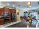 Modern kitchen with stainless steel appliances, granite countertops, and dark wood cabinetry at 290 Thomas Dr, Casselberry, FL 32707