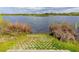 Concrete block boat ramp leads into a serene lake, surrounded by natural reeds and grasses at 290 Thomas Dr, Casselberry, FL 32707