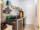Laundry room featuring modern front-loading washer and dryer, shelving and a door to the exterior at 290 Thomas Dr, Casselberry, FL 32707