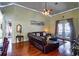 Inviting living room with hardwood floors, a ceiling fan, recessed lighting, and french doors at 290 Thomas Dr, Casselberry, FL 32707