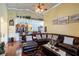 Spacious living room with hardwood floors and large windows at 290 Thomas Dr, Casselberry, FL 32707