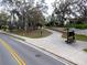Well-maintained walking path with a covered bench, inviting spot to enjoy nature and tranquility at 290 Thomas Dr, Casselberry, FL 32707