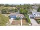 Charming blue home featuring lush landscaping and a well-maintained yard at 2909 Depauw Ave, Orlando, FL 32804
