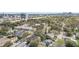 The aerial view captures the neighborhood, illustrating the home's setting among mature trees and city skyline at 2909 Depauw Ave, Orlando, FL 32804