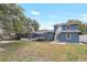 Spacious backyard features a screened porch, fire pit, and second story outdoor access at 2909 Depauw Ave, Orlando, FL 32804