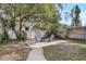 Backyard fire pit area with Adirondack chairs, perfect for outdoor gatherings at 2909 Depauw Ave, Orlando, FL 32804