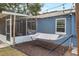 Backyard features hammock area, screened porch, and outdoor access to second story at 2909 Depauw Ave, Orlando, FL 32804