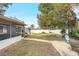 Large backyard featuring a screened in porch, outdoor seating area and room to play at 2909 Depauw Ave, Orlando, FL 32804