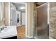 Bathroom with stone-tiled shower, and a modern vanity at 2909 Depauw Ave, Orlando, FL 32804