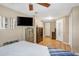 Spacious bedroom featuring wood floors, neutral decor, and ample storage space at 2909 Depauw Ave, Orlando, FL 32804