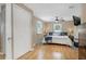 Bright bedroom featuring wood floors, ceiling fan, and two windows with blinds at 2909 Depauw Ave, Orlando, FL 32804
