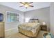 Comfortable bedroom with ceiling fan, window, and neutral paint at 2909 Depauw Ave, Orlando, FL 32804