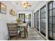 Bright dining room featuring hardwood floors, stylish furniture, and sunlit windows at 2909 Depauw Ave, Orlando, FL 32804