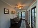 Cozy dining room with French doors, a ceiling fan, and a wine rack at 2909 Depauw Ave, Orlando, FL 32804