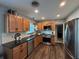 Kitchen featuring granite countertops, stainless steel appliances, and wooden cabinets at 2909 Depauw Ave, Orlando, FL 32804