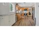 Spacious kitchen featuring wood-look floors, modern stainless steel appliances, and natural light at 2909 Depauw Ave, Orlando, FL 32804
