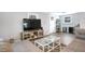 Contemporary living room features a sleek TV, modern entertainment center, and a stylish coffee table, perfect for entertaining at 2909 Depauw Ave, Orlando, FL 32804