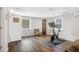 Inviting living room with hardwood floors, comfortable seating, exercise area, and natural light, perfect for a healthy lifestyle at 2909 Depauw Ave, Orlando, FL 32804