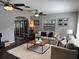Cozy living room with hardwood floors, neutral sofas, and an open doorway at 2909 Depauw Ave, Orlando, FL 32804