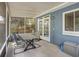 Relaxing screened porch with table, chairs, and access to home interior at 2909 Depauw Ave, Orlando, FL 32804