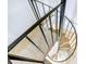 Unique carpeted spiral staircase connects floors, adding architectural interest and functionality to the home at 2909 Depauw Ave, Orlando, FL 32804