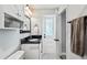 Functional bathroom with a sleek vanity, mirror, and tile floor offers a clean and bright space at 3117 Lake Mar Ln, Orlando, FL 32806