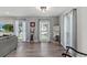 Bright living room with hardwood floors, neutral colors, and lots of windows at 3117 Lake Mar Ln, Orlando, FL 32806