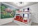 Fun bedroom with a bunk bed, Disney-themed wallpaper, and carpet flooring at 3962 Lana Ave, Davenport, FL 33897