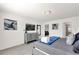 Comfortable bedroom with TV, dresser, soft carpet, and ensuite bathroom access at 3962 Lana Ave, Davenport, FL 33897