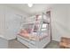 Charming bedroom with a bunk bed, themed wallpaper, and carpet flooring at 3962 Lana Ave, Davenport, FL 33897