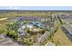 Aerial view of a resort-style community pool and amenities, set amongst lush landscaping at 3962 Lana Ave, Davenport, FL 33897
