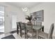 Dining room boasts an elegant light fixture and a neutral color palette, creating an inviting atmosphere at 3962 Lana Ave, Davenport, FL 33897