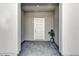 Covered front porch featuring a gray brick floor and gray walls, enhancing curb appeal at 3962 Lana Ave, Davenport, FL 33897